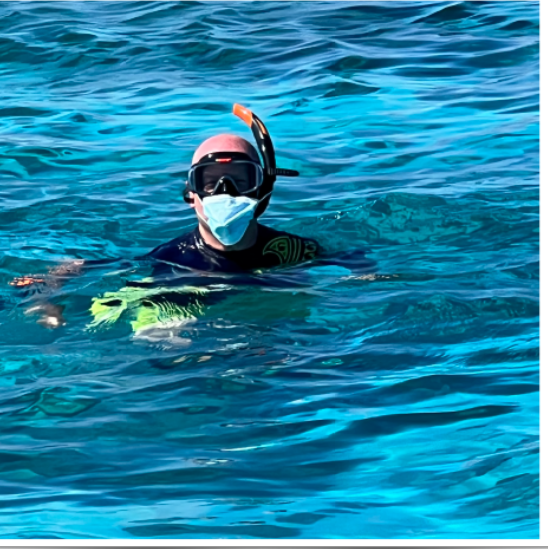 Peter with his head above water while diving